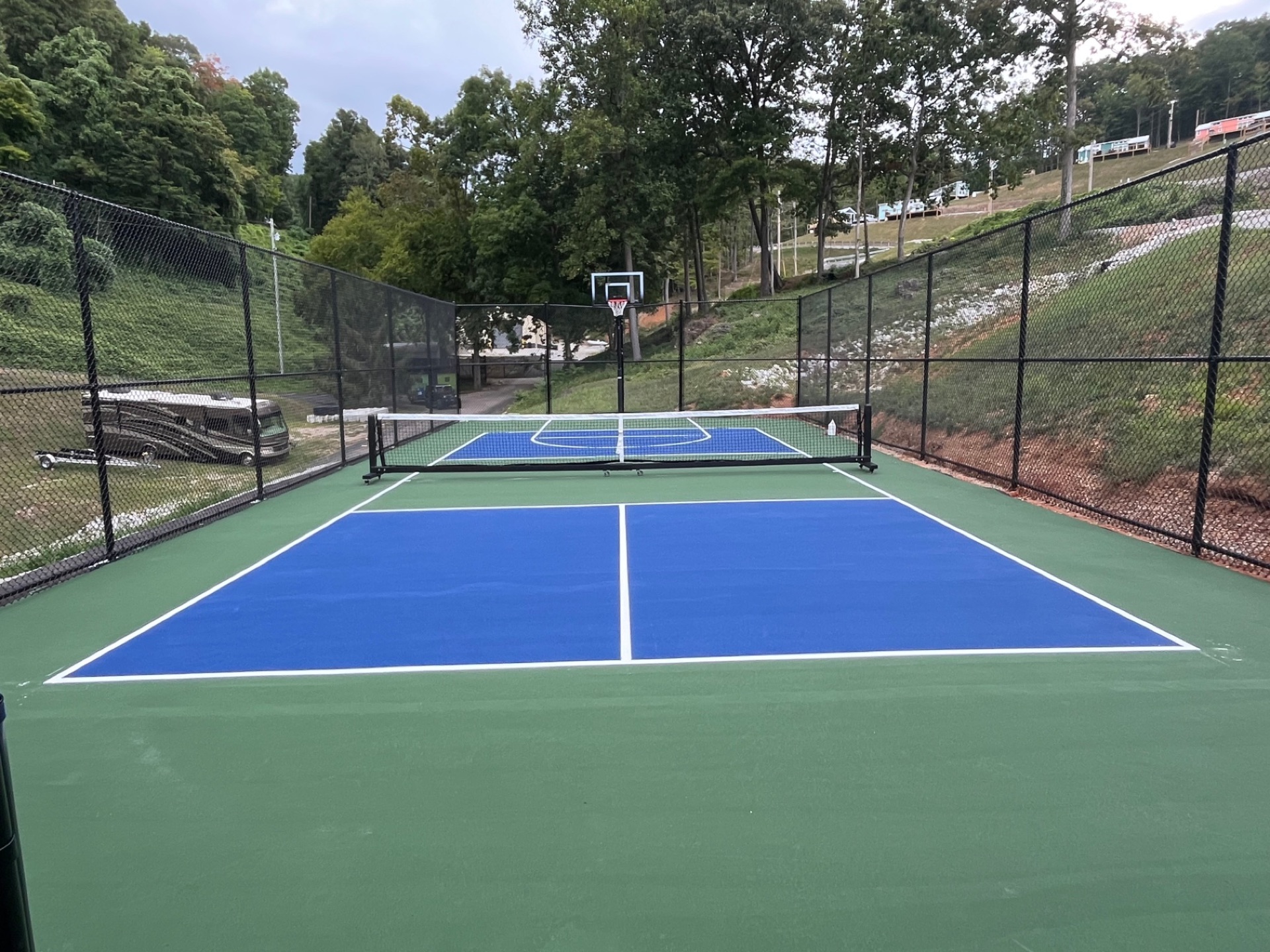 Resurfaced pickleball court with new acrylic colour coating